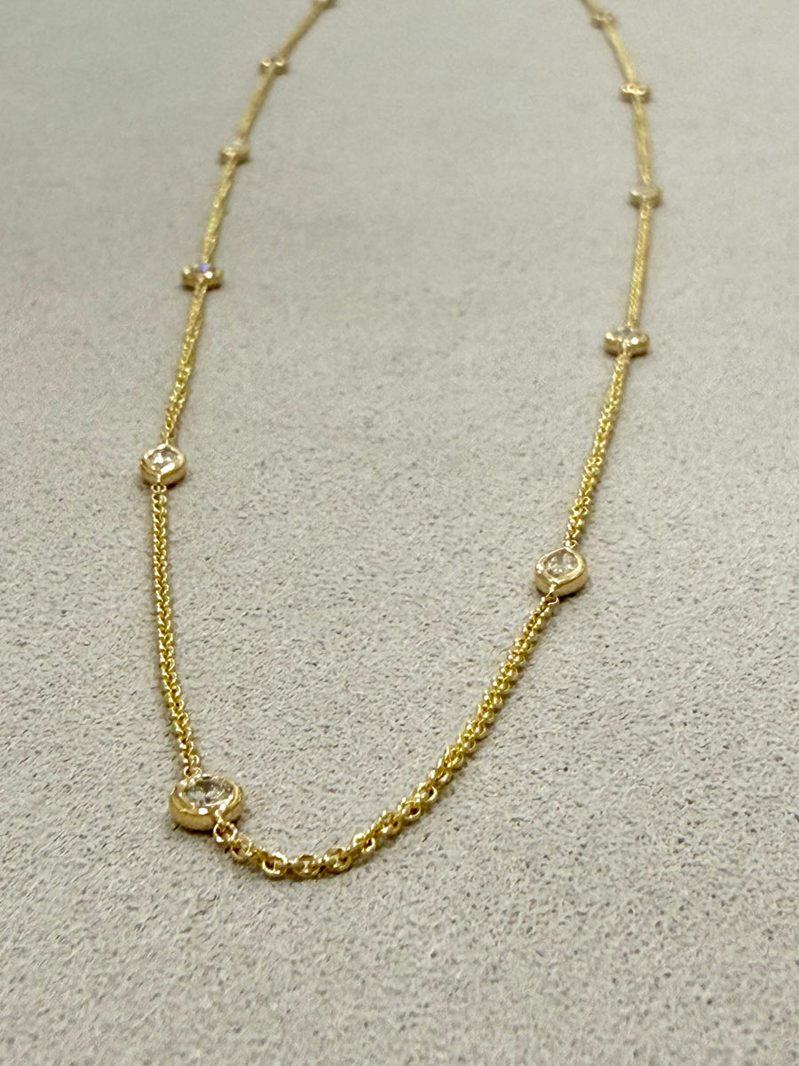 Diamond set yellow gold chain with marquise and round brilliant diamonds