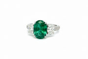 Trilogy Oval Emerald and diamond white gold ring