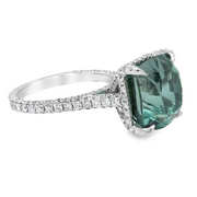 Ring with a green natural Tourmaline gemstone and diamond-studded white gold band 