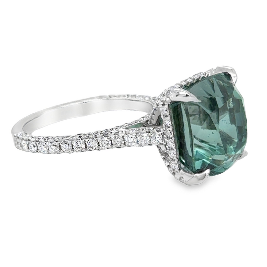 Ring with a green natural Tourmaline gemstone and diamond-studded white gold band 