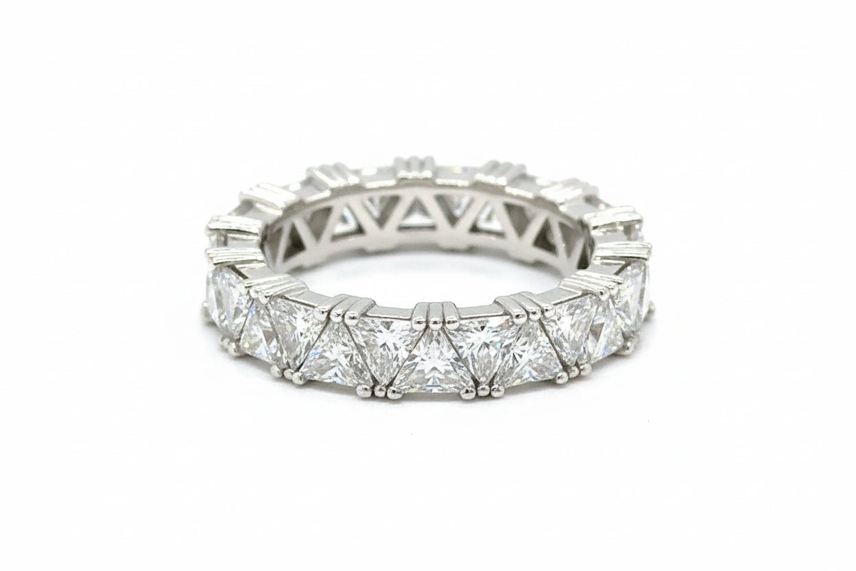Diamond ring with intricate design on a white background