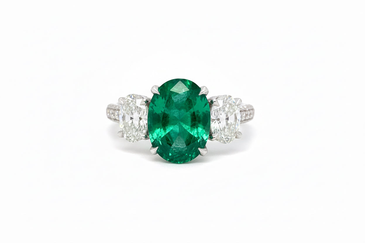 Trilogy Oval Emerald and diamond white gold ring