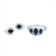 Trilogy  blue Sapphires and Diamond halo Ring