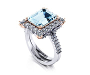 18ct White and rose gold emerald cut Aquamarine and Diamond halo Ring