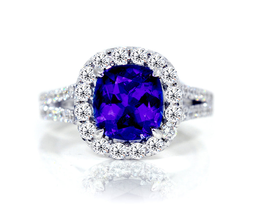 18ct White gold cushion cut tanzanite ring with a halo of diamonds