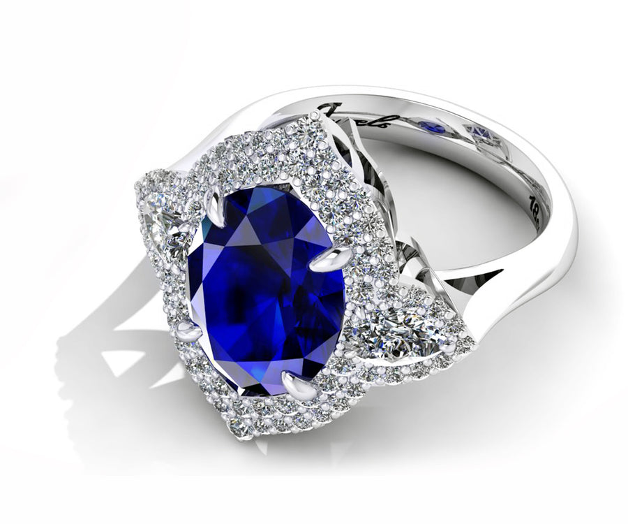 18ct White gold 5ct oval tanzanite dress ring with pave diamonds