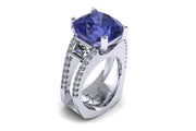 18ct White gold claw set cushion cut tanzanite with two trillion diamonds