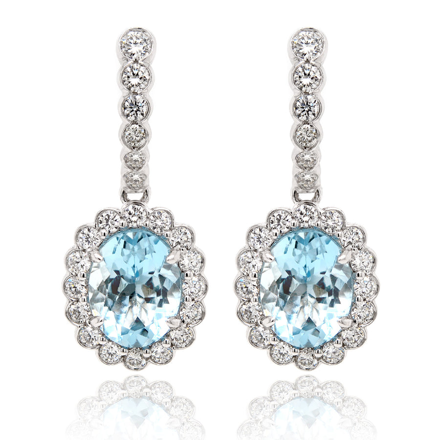 Oval Aquamarine Drop Earrings with a Halo of Diamonds